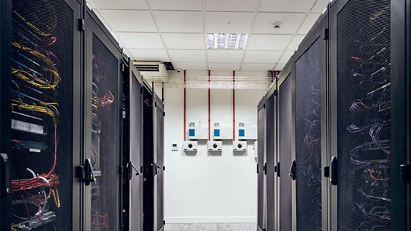 Interior view of a datacenter with rows of server racks